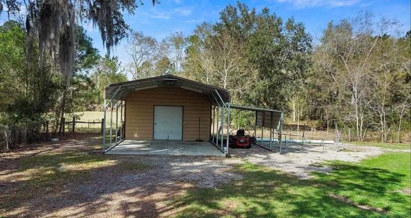 5717 Southwest County Rd Lake Lake Butler, FL 32054 - Photo 17 of 19 a front view of a house with a yard