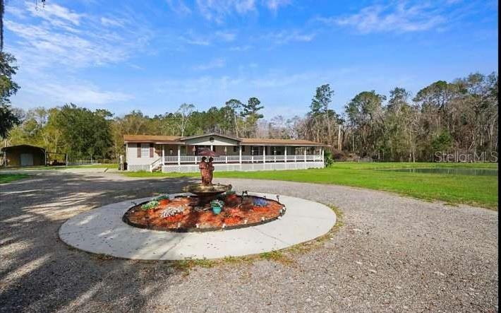 5717 Southwest County Rd Lake Lake Butler, FL 32054 - Photo 3 of 19 a view of a swimming pool with a yard