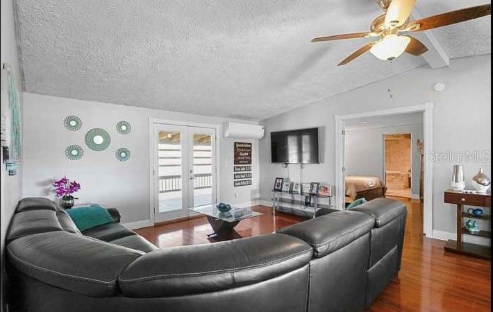 5717 Southwest County Rd Lake Lake Butler, FL 32054 - Photo 6 of 19 a living room with furniture and a flat screen tv