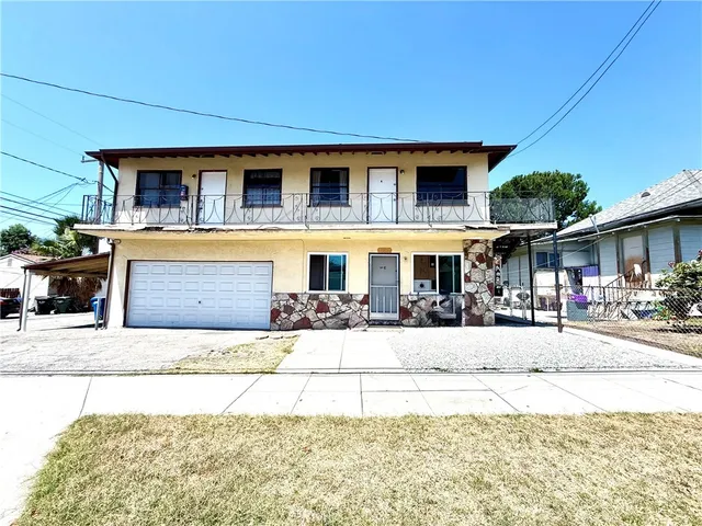 a front view of a house with a patio