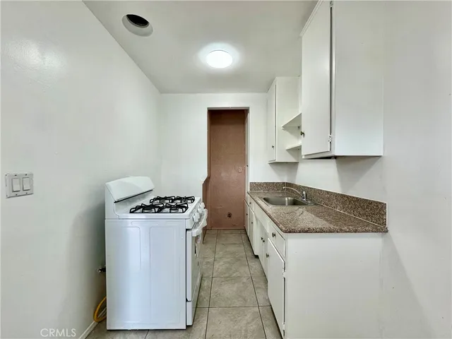 a kitchen with a stove and a microwave