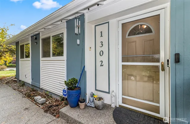 a potted plant sitting in front of a house