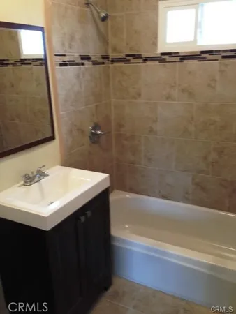 a bathroom with a sink and a bathtub