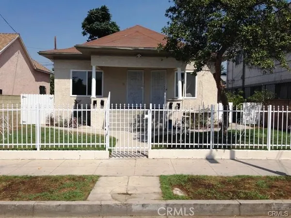 a view of a house with a small garden