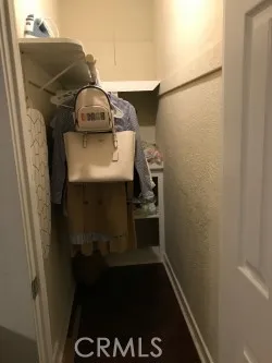 a bedroom that has a bed and a table in it