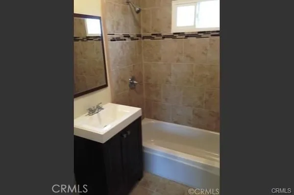 a bathroom with a sink toilet and tub