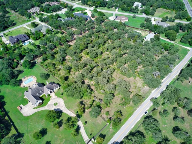 a backyard of a house with a yard and outdoor seating
