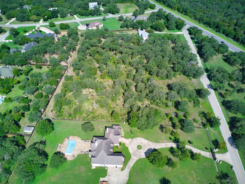 14901 Hog Eye Road Manor, TX 78653 - Photo 17 of 22 a backyard of a house with a yard and outdoor seating