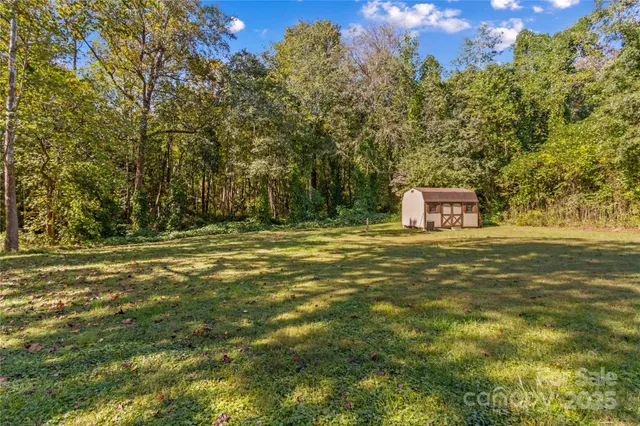 a house view with a trees