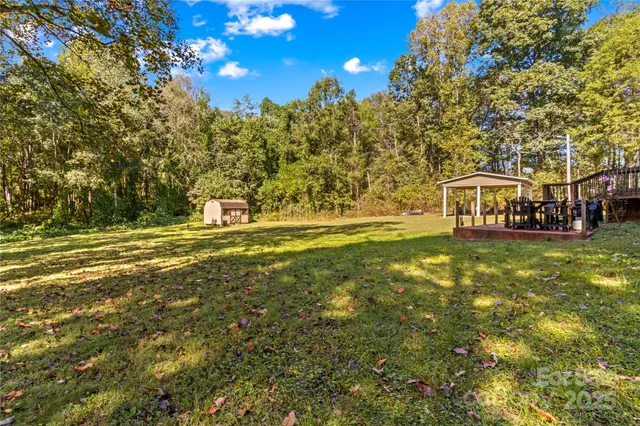 a view of a house with a big yard