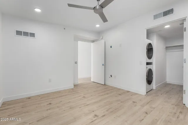 an empty room with wooden floor