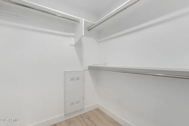 a view of an empty walk in closet
