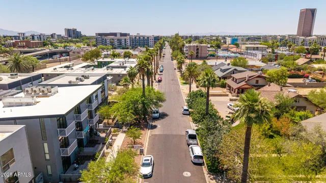 a view of kitchen with refrigerator and dining table