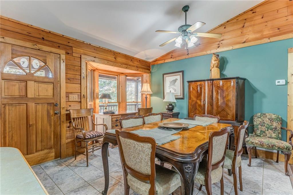 4569 Old Dalton Road Northeast Rome, GA 30165 - Photo 11 of 53 a dining room with furniture a chandelier and window