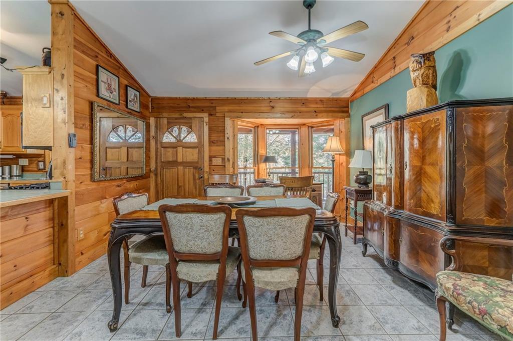 4569 Old Dalton Road Northeast Rome, GA 30165 - Photo 12 of 53 a dining room with furniture a chandelier and a rug