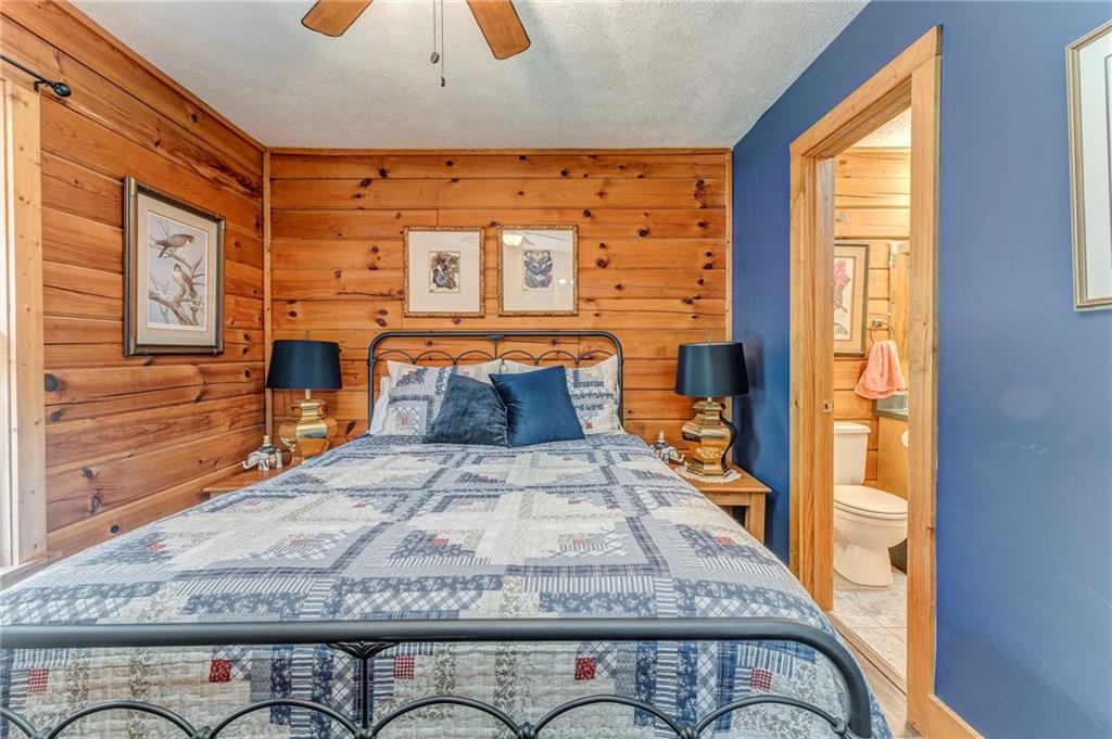 4569 Old Dalton Road Northeast Rome, GA 30165 - Photo 24 of 53 a bedroom with a bed and wooden floor