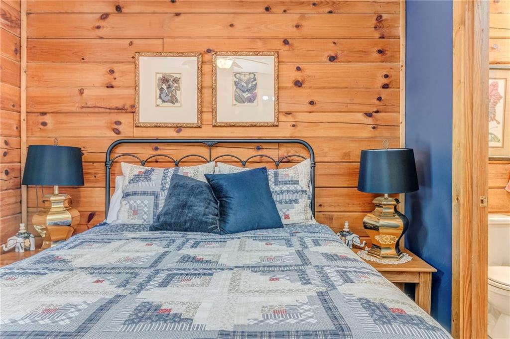 4569 Old Dalton Road Northeast Rome, GA 30165 - Photo 25 of 53 a bedroom with a bed and a night stand