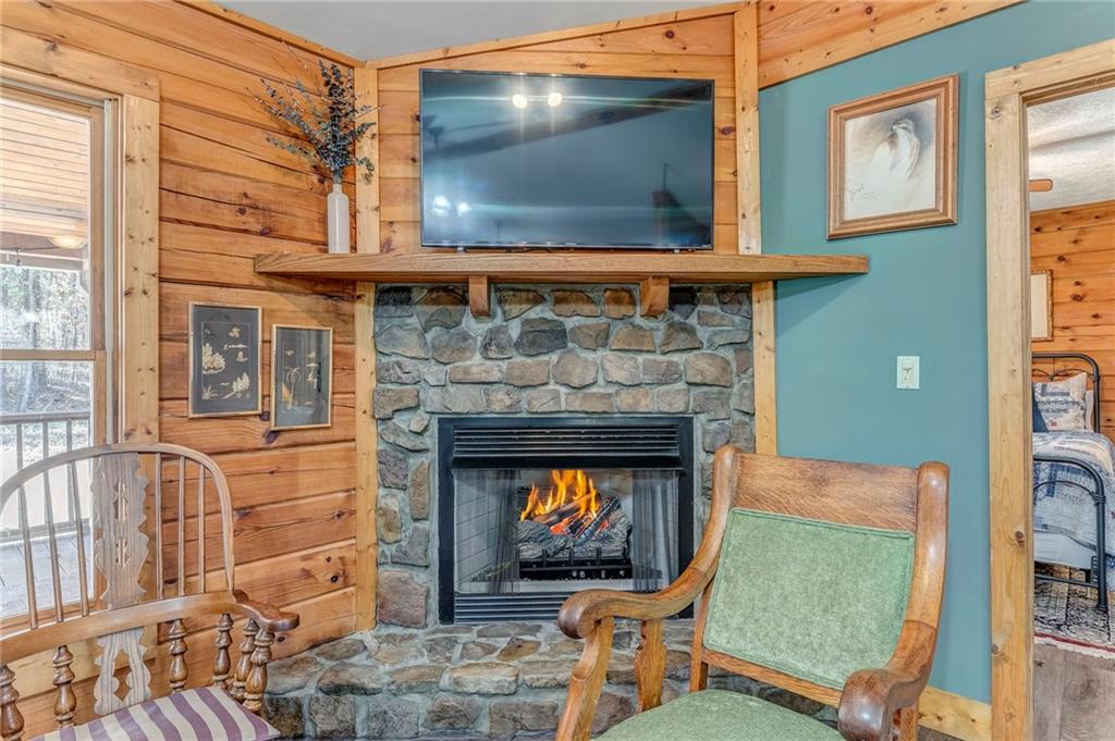 4569 Old Dalton Road Northeast Rome, GA 30165 - Photo 3 of 53 a living room with furniture a flat screen tv and a fireplace