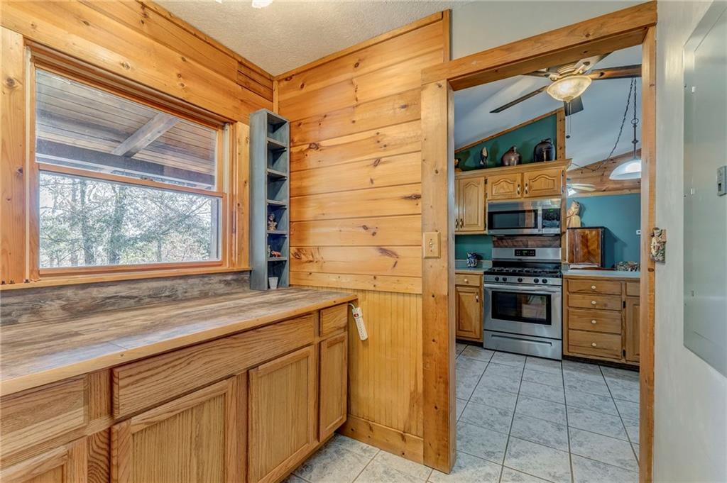 4569 Old Dalton Road Northeast Rome, GA 30165 - Photo 31 of 53 a kitchen with stainless steel appliances a stove and a refrigerator