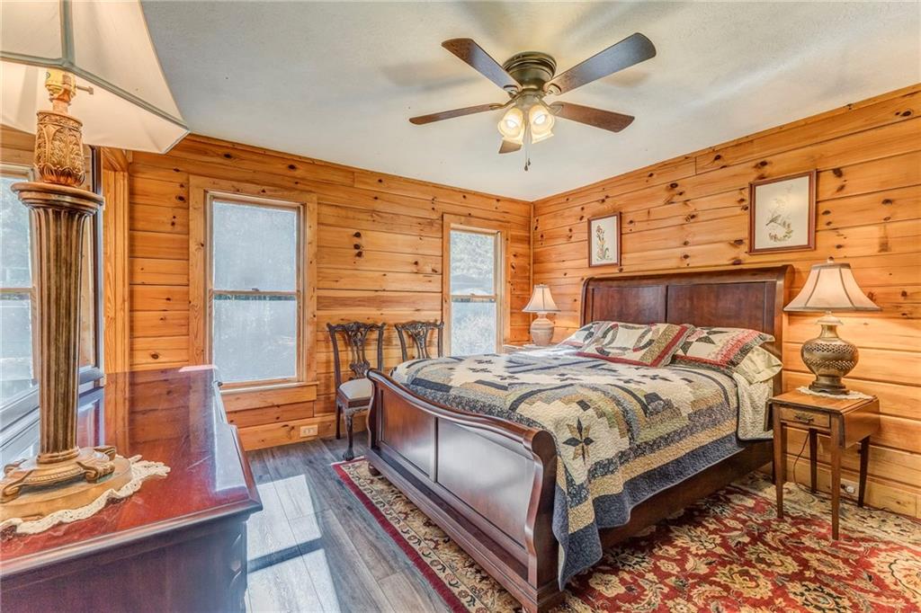 4569 Old Dalton Road Northeast Rome, GA 30165 - Photo 33 of 53 a bedroom with a bed and a chandelier