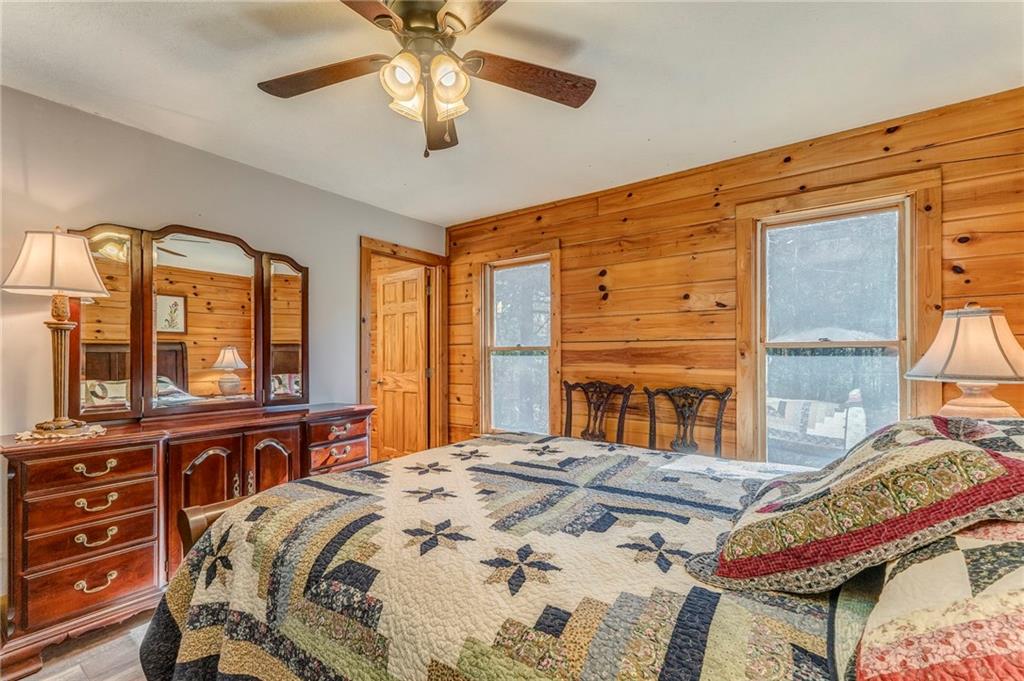 4569 Old Dalton Road Northeast Rome, GA 30165 - Photo 34 of 53 a bedroom with a bed and a large window with the outer view