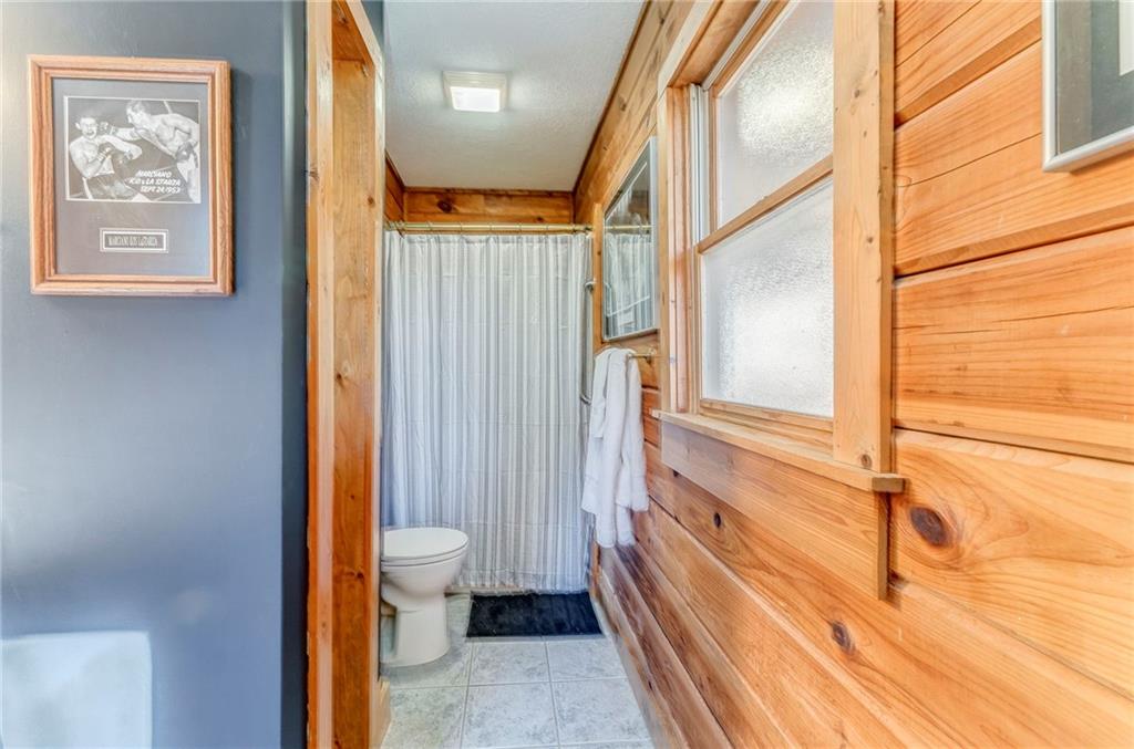 4569 Old Dalton Road Northeast Rome, GA 30165 - Photo 39 of 53 a bathroom with a toilet sink and a shower