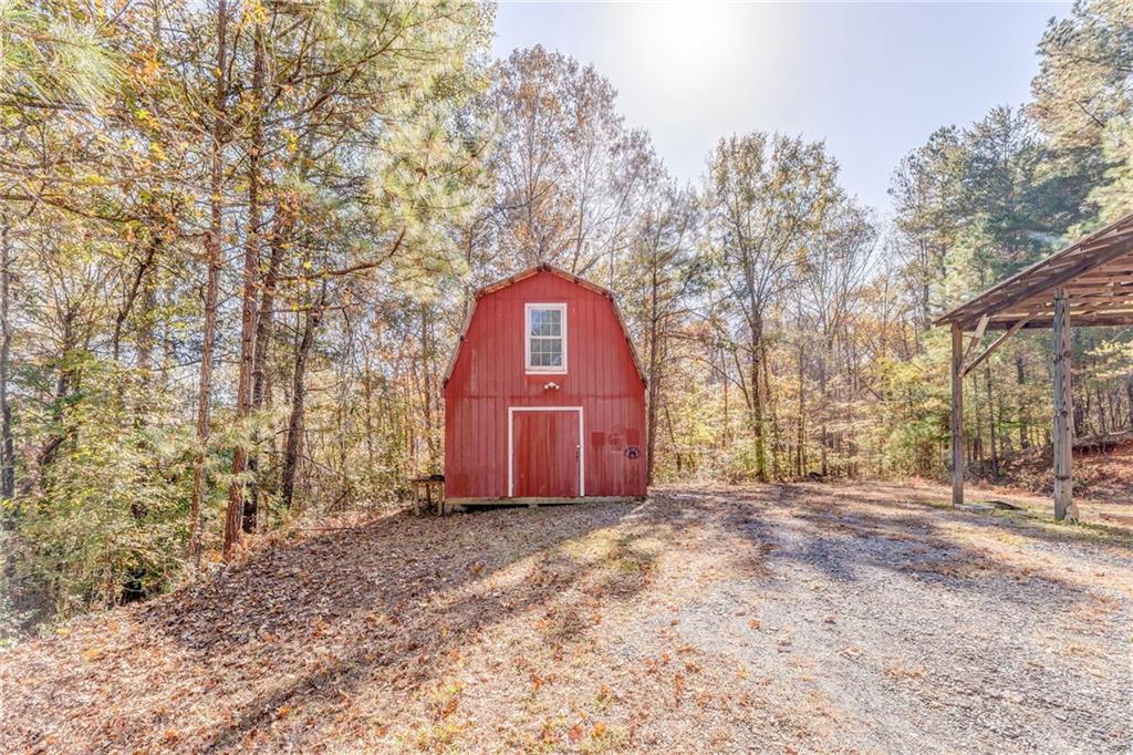 4569 Old Dalton Road Northeast Rome, GA 30165 - Photo 49 of 53 a front view of a house with a yard