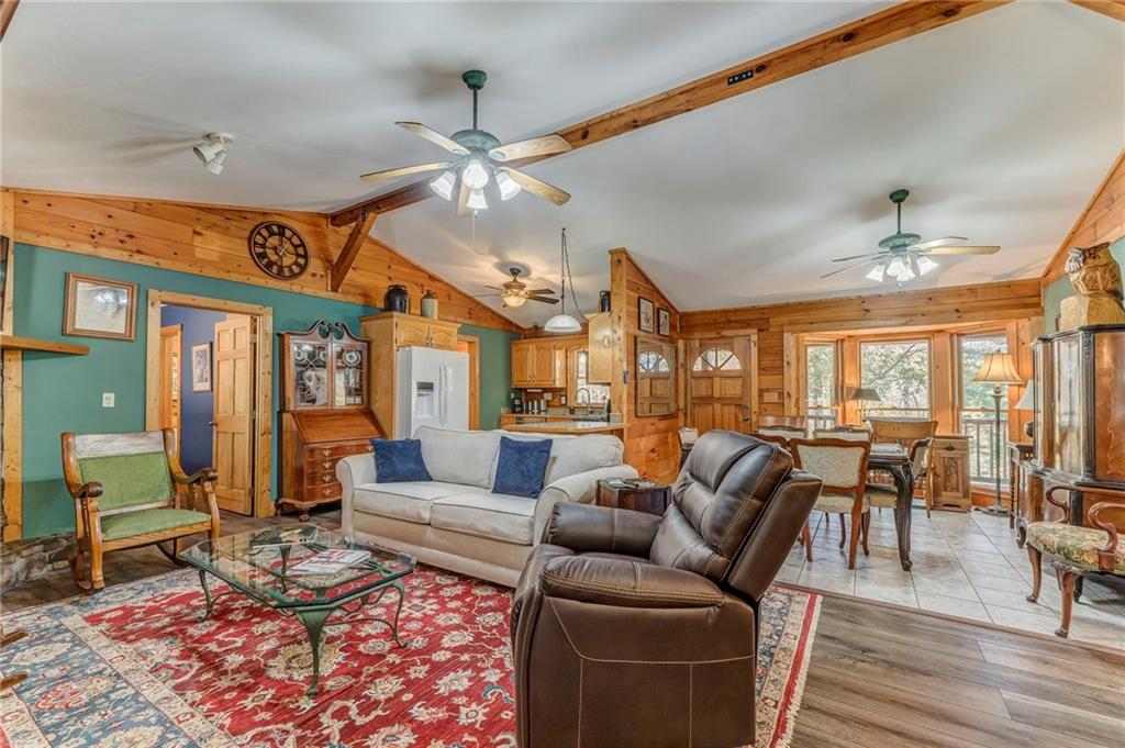 4569 Old Dalton Road Northeast Rome, GA 30165 - Photo 5 of 53 a living room with furniture ceiling fan and a rug