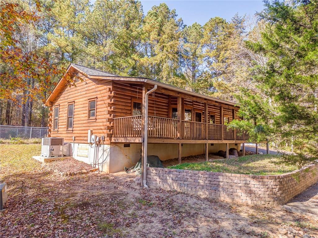4569 Old Dalton Road Northeast Rome, GA 30165 - Photo 51 of 53 a backyard of a house with wooden floor and outdoor seating