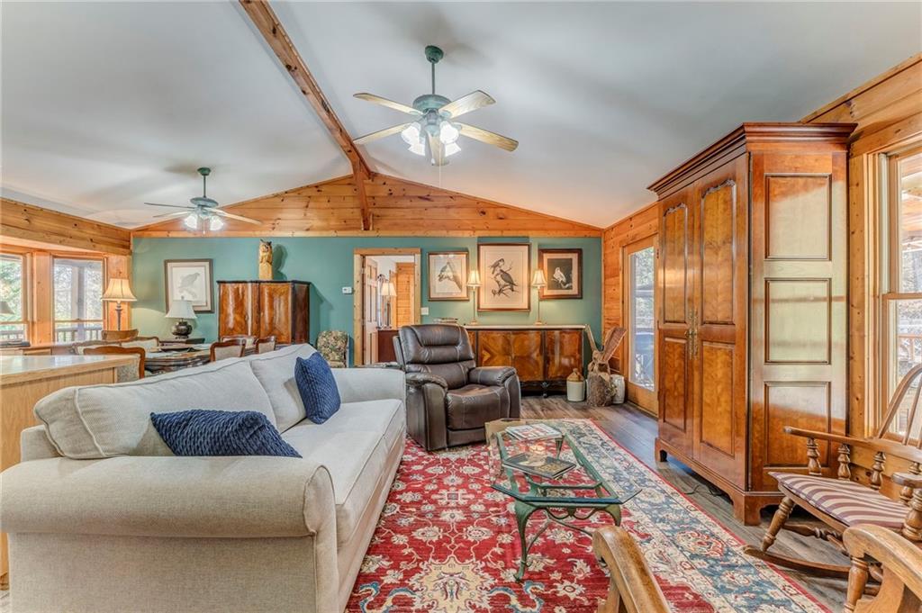 4569 Old Dalton Road Northeast Rome, GA 30165 - Photo 9 of 53 a living room with furniture and a chandelier