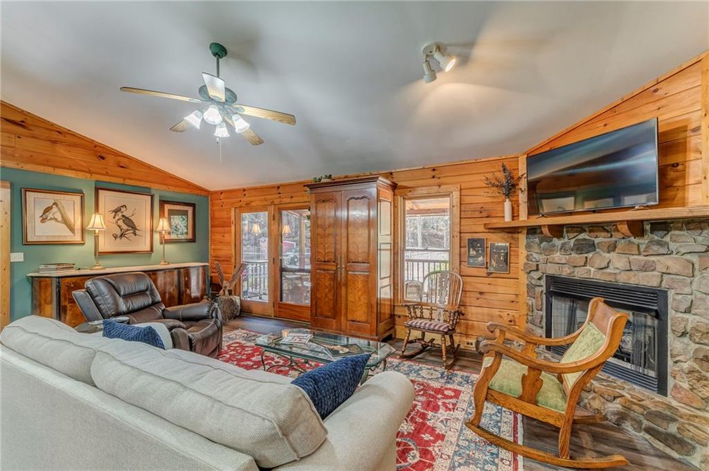 4569 Old Dalton Road Northeast Rome, GA 30165 - Photo 10 of 53 a living room with furniture a fireplace and a flat screen tv