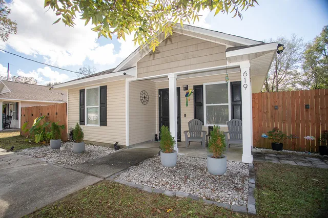 a front view of a house with garden