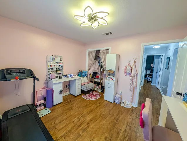 a tree in front of a white house