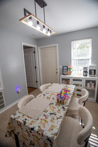 a bed room with a bed mirror and a window