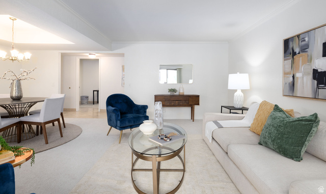 6936 South 775 East, Unit B Midvale, UT 84047 - Photo 6 of 33 Living area with a chandelier and crown molding