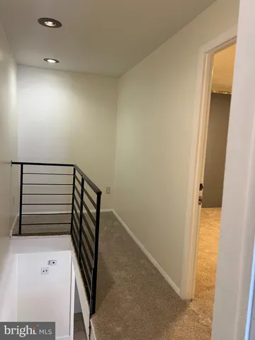 a view of a car park in front of house