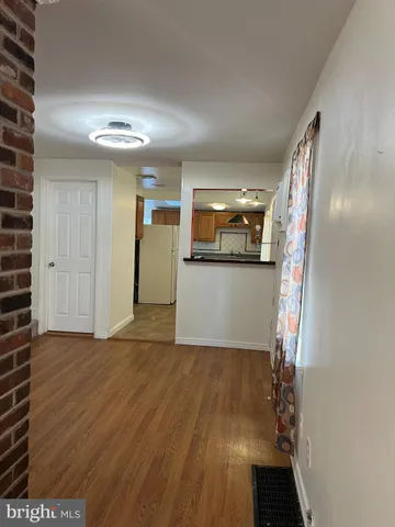 a kitchen with stainless steel appliances a refrigerator and a stove top oven