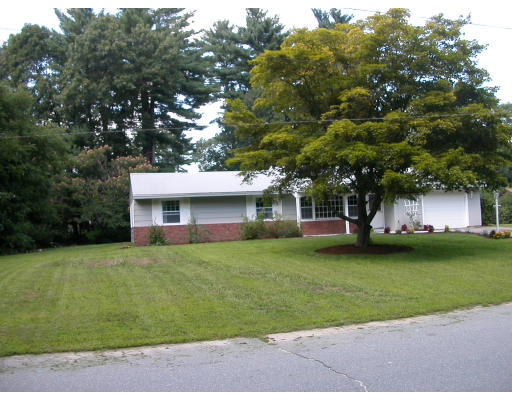 27 Samuel Road Chelmsford, MA 01824 - Photo 1 of 1 a front view of a house with a garden