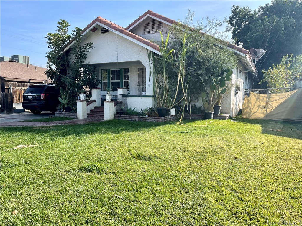 1718 Fairmount Boulevard Riverside, CA 92501 - Photo 1 of 1 a view of a house with a yard patio and fire pit