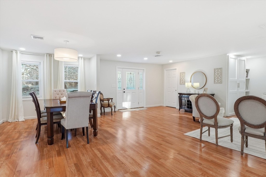 186 Mohawk Trail Haverhill, MA 01832 - Photo 13 of 42 a view of a dining room with furniture window and wooden floor