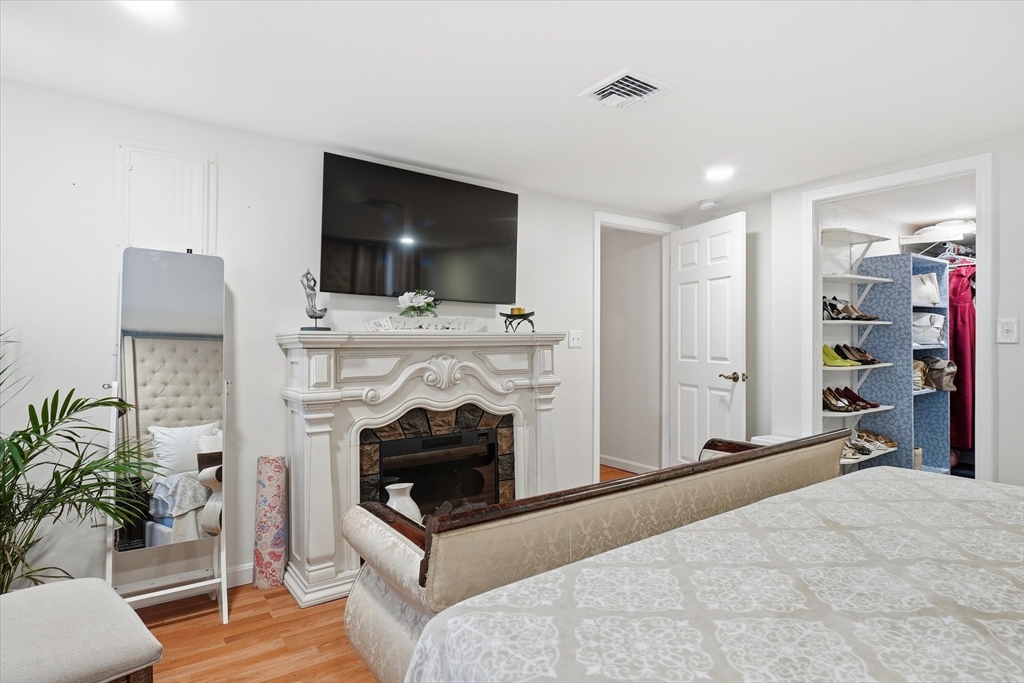 186 Mohawk Trail Haverhill, MA 01832 - Photo 30 of 42 a living room with furniture and a fireplace