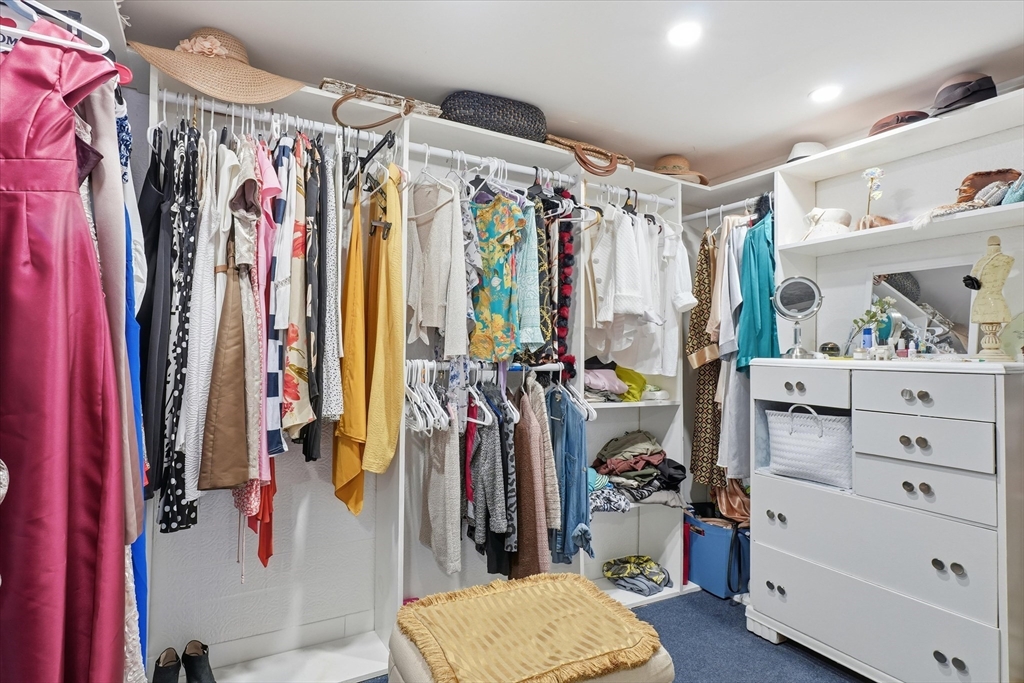 186 Mohawk Trail Haverhill, MA 01832 - Photo 31 of 42 a view of walk in closet with clothes