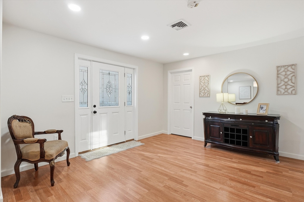 186 Mohawk Trail Haverhill, MA 01832 - Photo 8 of 42 a view of room with furniture and wooden floor