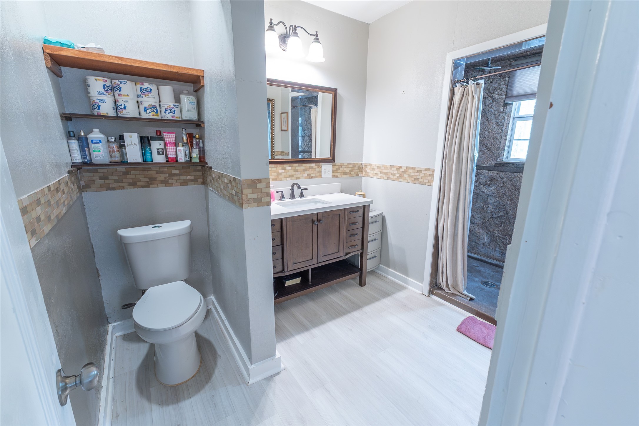2118 Rolling Hills Road Conroe, TX 77303 - Photo 25 of 39 Bright bathroom features a spacious vanity and thoughtful layout.