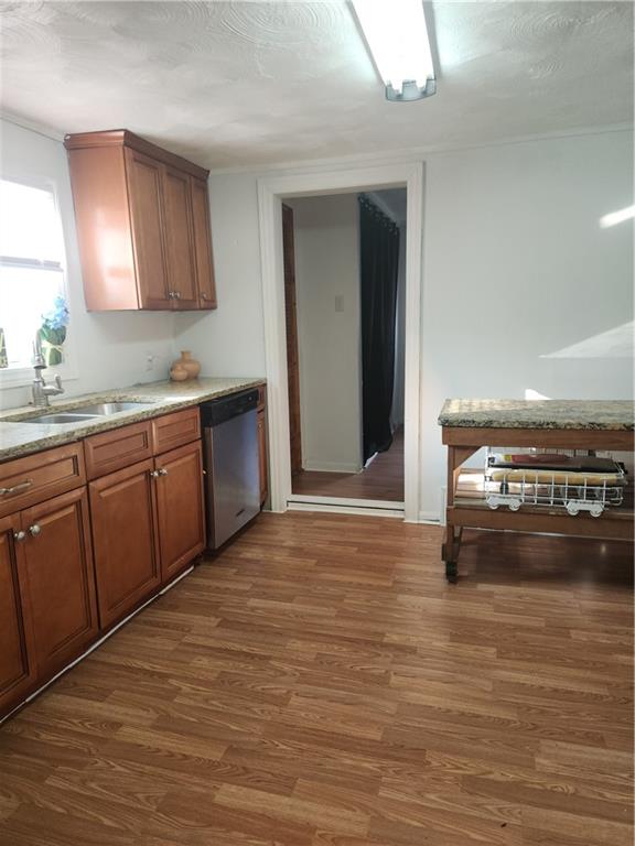 1957 Millerstown Road Tarentum, PA 15084 - Photo 6 of 14 a kitchen with stainless steel appliances granite countertop a sink counter space and wooden floor