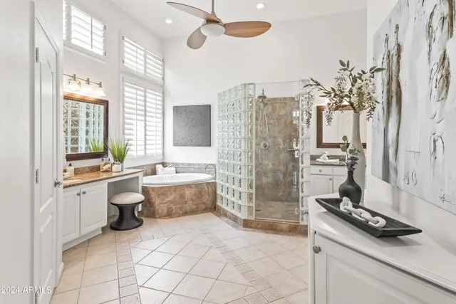 a large white kitchen with a large window