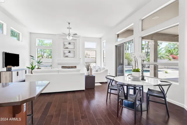 a view of a dining room with furniture window and wooden floor