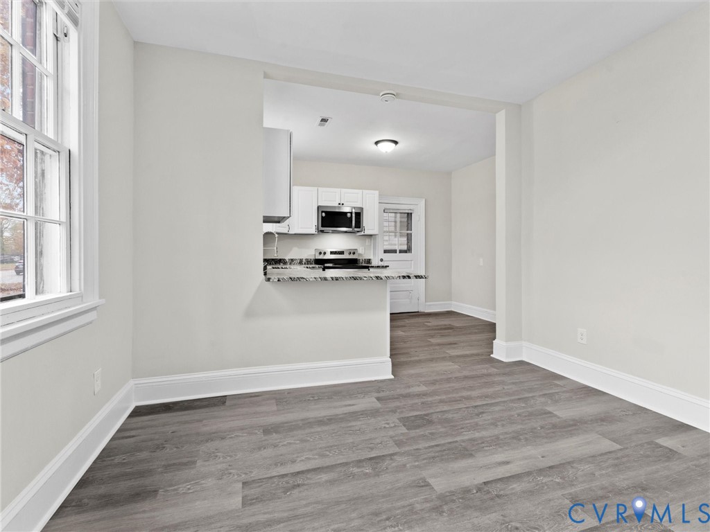 3928 East Broad Rock Road Richmond, VA 23224 - Photo 13 of 34 a view of kitchen and wooden floor