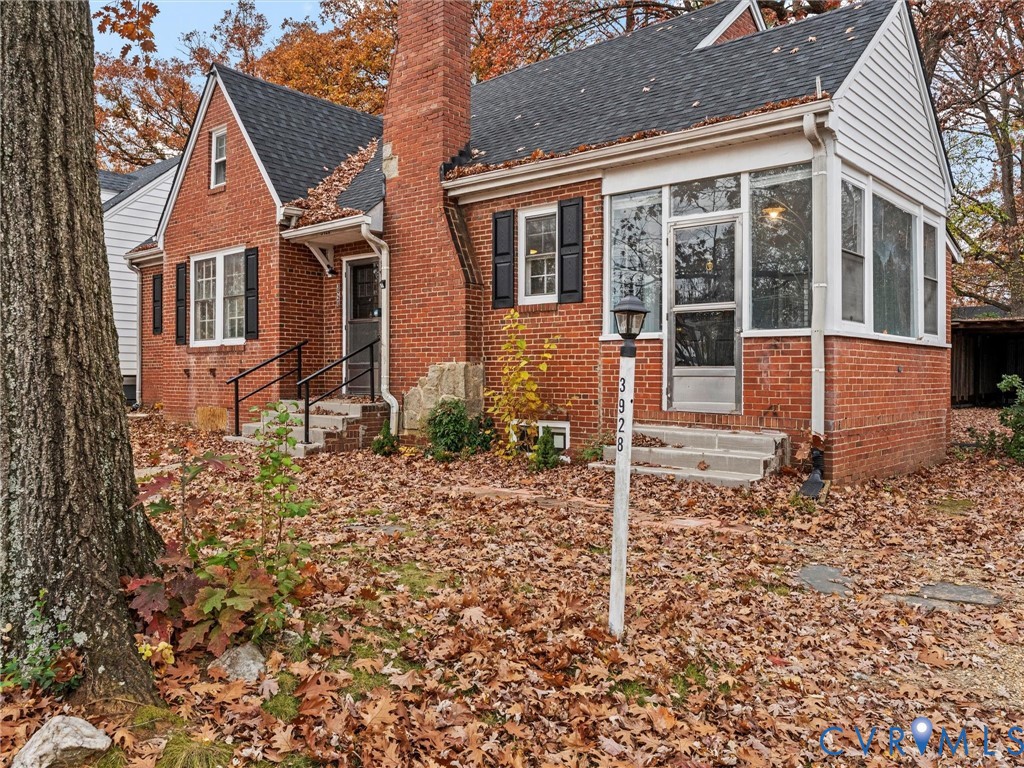 3928 East Broad Rock Road Richmond, VA 23224 - Photo 2 of 34 front view of a house with a yard