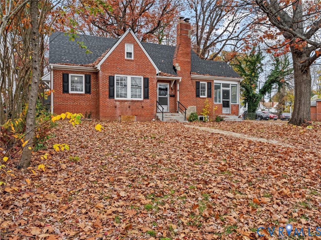 3928 East Broad Rock Road Richmond, VA 23224 - Photo 4 of 34 a front view of a house with a large tree
